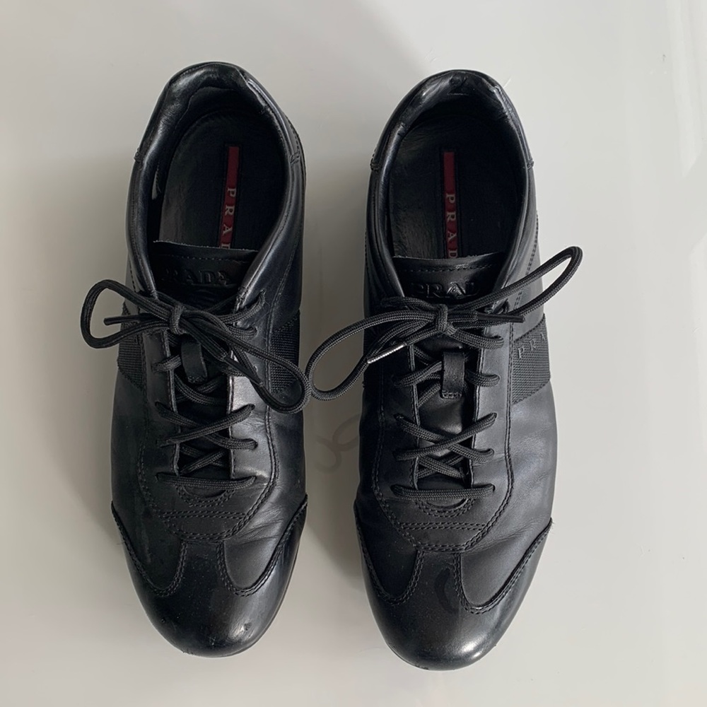 Black lace up Prada mens sneakers.